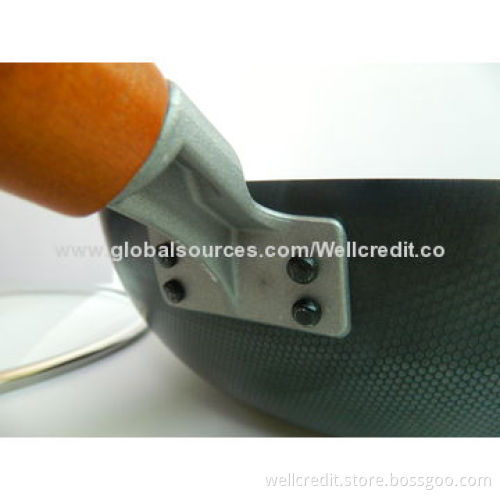 Carbon steel wok with wooden handle